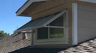 Residential aluminum window awnings tan colored.