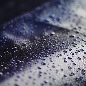 Blue tarpaulin with water drops on it