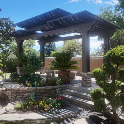 Patio cover with lattice roof, wood look.