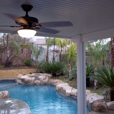 Patio cover with solid roof, wood look.