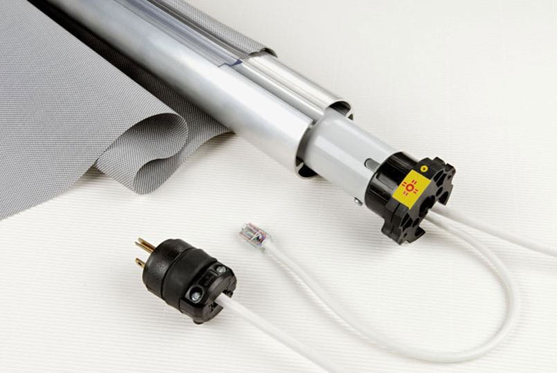 partially disassembled window roller shade and motor