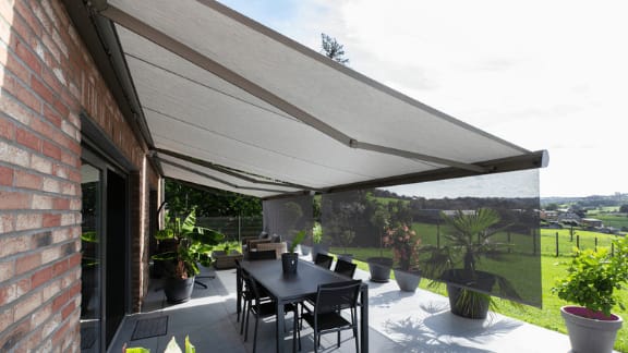Retractable awning extended over a residential patio